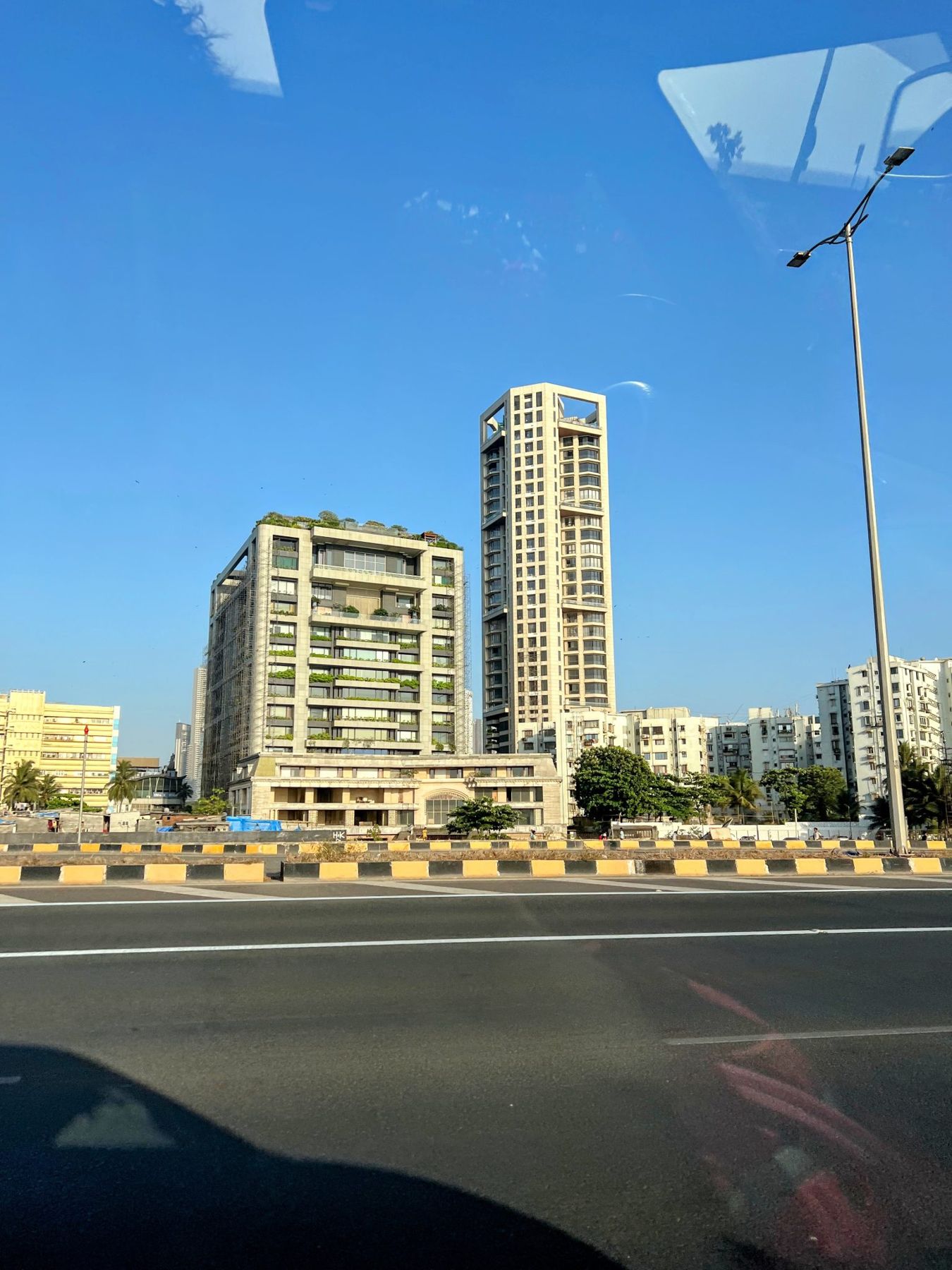 Modern high-rise apartment towers against a blue sky